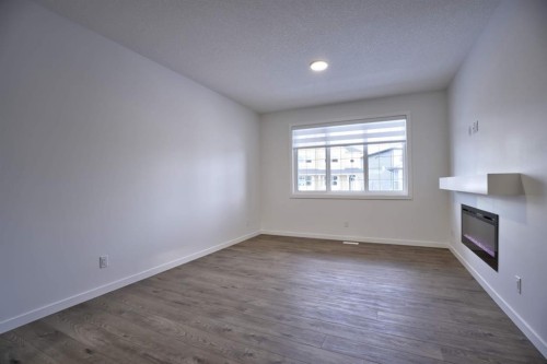 45 Legacy Point Terrace Se, Calgary, AB - Indoor Photo Showing Other Room With Fireplace