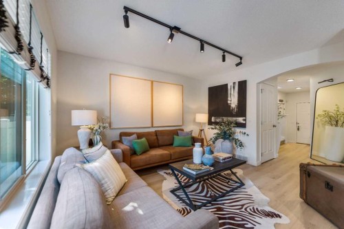 19 Everridge Villas Sw, Calgary, AB - Indoor Photo Showing Living Room