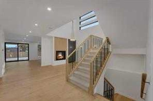 3511 34 Avenue Sw, Calgary, AB - Indoor Photo Showing Other Room With Fireplace
