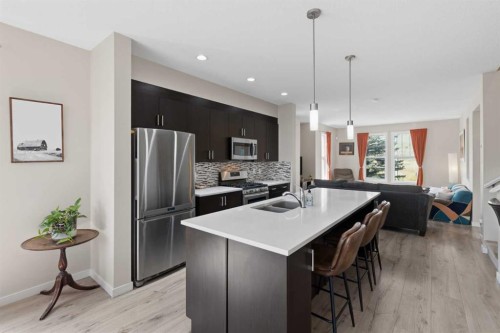 33 Chaparral Valley Park, Calgary, AB - Indoor Photo Showing Kitchen With Stainless Steel Kitchen With Double Sink With Upgraded Kitchen