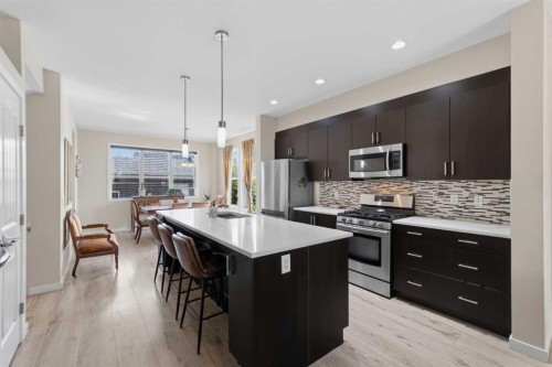33 Chaparral Valley Park, Calgary, AB - Indoor Photo Showing Kitchen With Stainless Steel Kitchen With Double Sink With Upgraded Kitchen