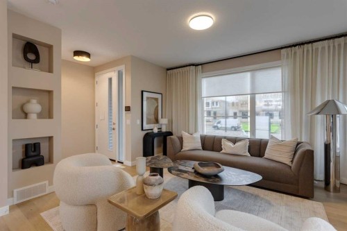 189 Cobblestone Gate Sw, Airdrie, AB - Indoor Photo Showing Living Room With Fireplace