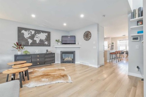 28 Copperfield Heath Se, Calgary, AB - Indoor Photo Showing Living Room With Fireplace