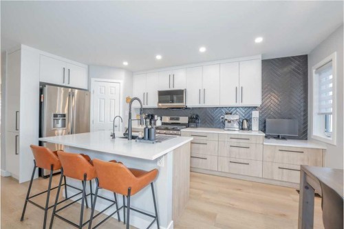 28 Copperfield Heath Se, Calgary, AB - Indoor Photo Showing Kitchen With Stainless Steel Kitchen With Double Sink With Upgraded Kitchen