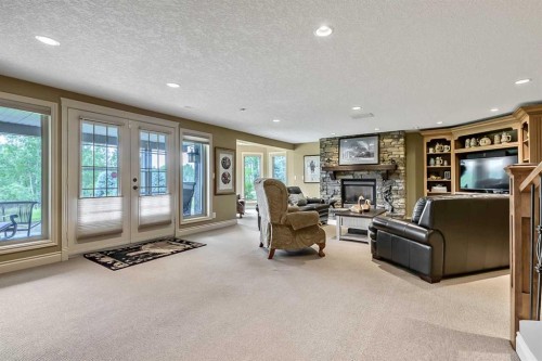34 Sunrise Way, Priddis Greens, AB - Indoor With Fireplace