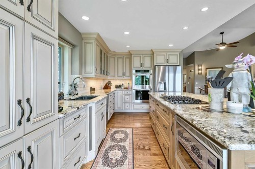 34 Sunrise Way, Priddis Greens, AB - Indoor Photo Showing Kitchen With Stainless Steel Kitchen With Upgraded Kitchen