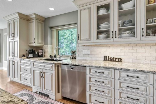 34 Sunrise Way, Priddis Greens, AB - Indoor Photo Showing Kitchen With Stainless Steel Kitchen With Upgraded Kitchen