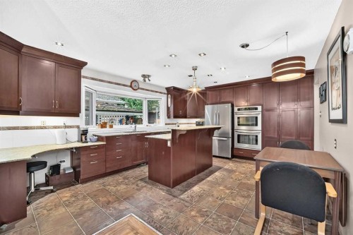 728 Willacy Drive Se, Calgary, AB - Indoor Photo Showing Kitchen With Stainless Steel Kitchen