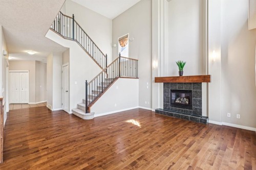 91 St Moritz Terrace Sw, Calgary, AB - Indoor Photo Showing Living Room With Fireplace
