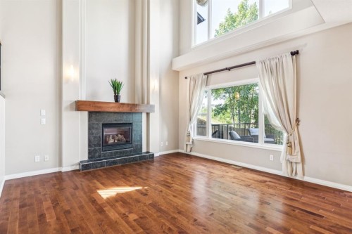 91 St Moritz Terrace Sw, Calgary, AB - Indoor Photo Showing Living Room With Fireplace