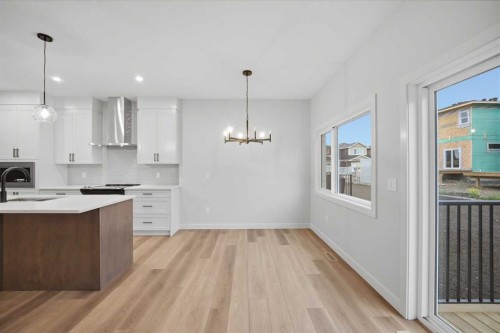 145 Topaz Place, Cochrane, AB - Indoor Photo Showing Kitchen With Upgraded Kitchen