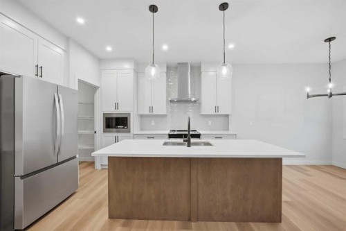 145 Topaz Place, Cochrane, AB - Indoor Photo Showing Kitchen With Upgraded Kitchen
