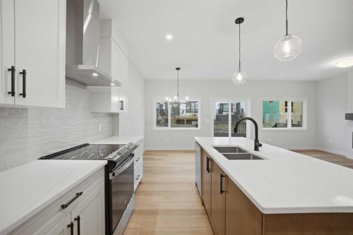 145 Topaz Place, Cochrane, AB - Indoor Photo Showing Kitchen With Double Sink With Upgraded Kitchen