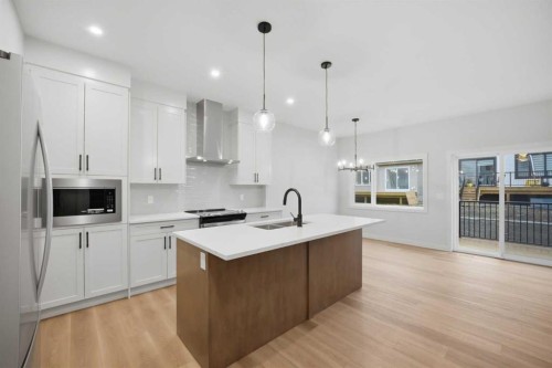 145 Topaz Place, Cochrane, AB - Indoor Photo Showing Kitchen With Upgraded Kitchen