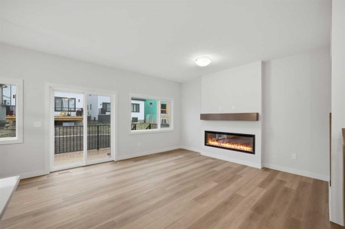 145 Topaz Place, Cochrane, AB - Indoor Photo Showing Living Room With Fireplace