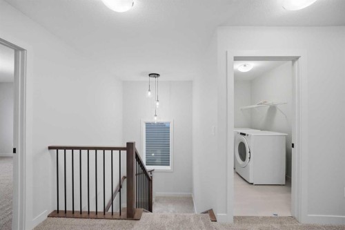 145 Topaz Place, Cochrane, AB - Indoor Photo Showing Laundry Room