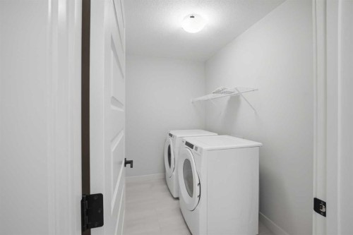 145 Topaz Place, Cochrane, AB - Indoor Photo Showing Laundry Room