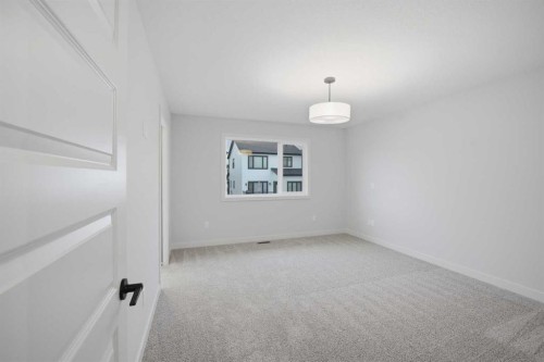 145 Topaz Place, Cochrane, AB - Indoor Photo Showing Other Room