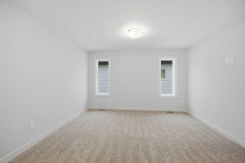 145 Topaz Place, Cochrane, AB - Indoor Photo Showing Other Room