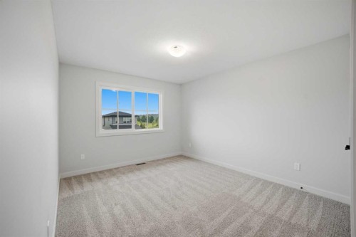 145 Topaz Place, Cochrane, AB - Indoor Photo Showing Other Room