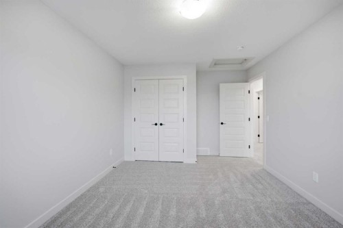 145 Topaz Place, Cochrane, AB - Indoor Photo Showing Other Room