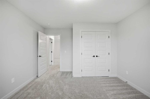 145 Topaz Place, Cochrane, AB - Indoor Photo Showing Other Room