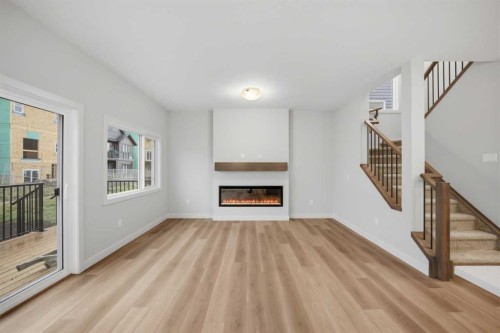 145 Topaz Place, Cochrane, AB - Indoor Photo Showing Living Room With Fireplace