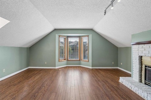 728 Shawnee Drive Sw, Calgary, AB - Indoor Photo Showing Other Room With Fireplace