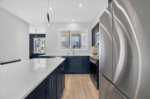 401-81 Midtown Boulevard Sw, Airdrie, AB - Indoor Photo Showing Kitchen With Stainless Steel Kitchen With Upgraded Kitchen