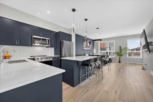401-81 Midtown Boulevard Sw, Airdrie, AB - Indoor Photo Showing Kitchen With Stainless Steel Kitchen With Double Sink With Upgraded Kitchen