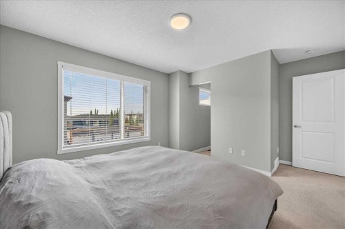 401-81 Midtown Boulevard Sw, Airdrie, AB - Indoor Photo Showing Bedroom