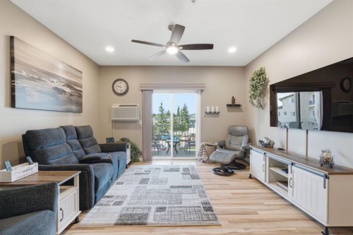 207-72 Quigley Drive, Cochrane, AB - Indoor Photo Showing Living Room