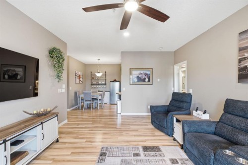207-72 Quigley Drive, Cochrane, AB - Indoor Photo Showing Living Room