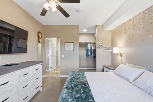 207-72 Quigley Drive, Cochrane, AB - Indoor Photo Showing Bedroom