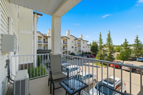 207-72 Quigley Drive, Cochrane, AB - Outdoor With Exterior