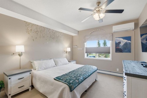 207-72 Quigley Drive, Cochrane, AB - Indoor Photo Showing Bedroom