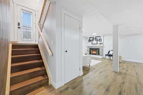 2220 Paliswood Road Sw, Calgary, AB - Indoor Photo Showing Other Room With Fireplace