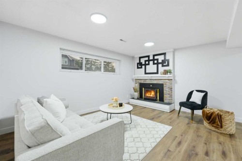 2220 Paliswood Road Sw, Calgary, AB - Indoor Photo Showing Living Room With Fireplace