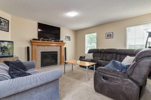 880 Prestwick Circle Se, Calgary, AB - Indoor Photo Showing Living Room With Fireplace