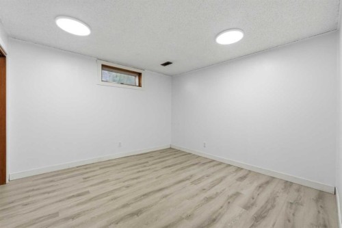 20 Rossburn Crescent Sw, Calgary, AB - Indoor Photo Showing Other Room