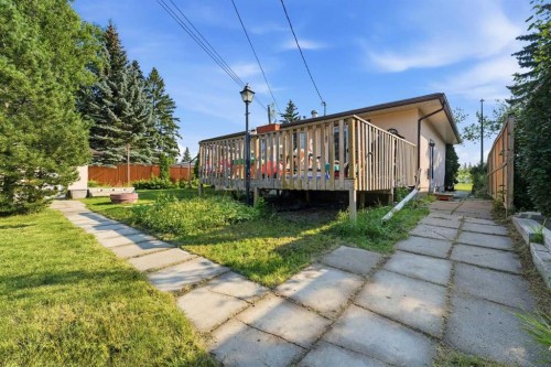 20 Rossburn Crescent Sw, Calgary, AB - Outdoor With Deck Patio Veranda