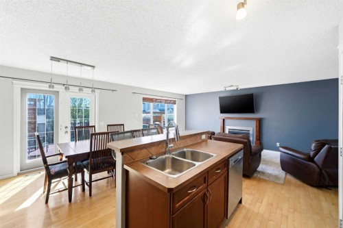 78 Cougar Plateau Way Sw, Calgary, AB - Indoor With Fireplace