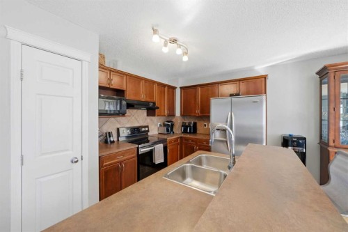 78 Cougar Plateau Way Sw, Calgary, AB - Indoor Photo Showing Kitchen With Stainless Steel Kitchen With Double Sink