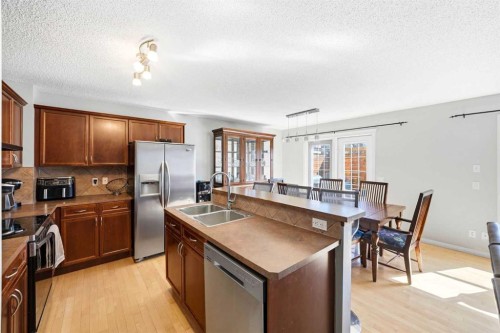 78 Cougar Plateau Way Sw, Calgary, AB - Indoor Photo Showing Kitchen With Stainless Steel Kitchen With Double Sink