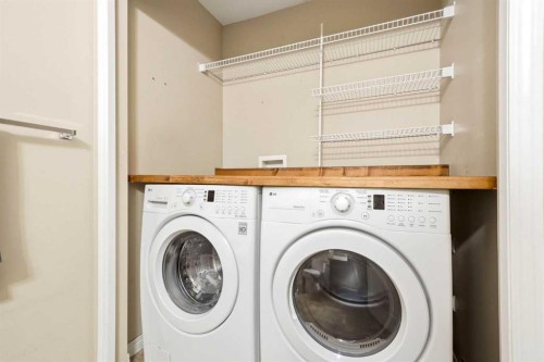78 Cougar Plateau Way Sw, Calgary, AB - Indoor Photo Showing Laundry Room