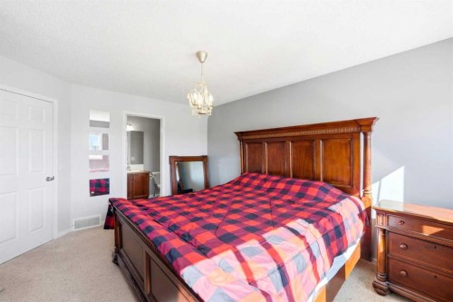 78 Cougar Plateau Way Sw, Calgary, AB - Indoor Photo Showing Bedroom