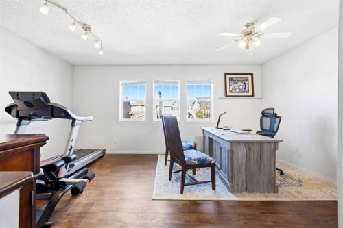 78 Cougar Plateau Way Sw, Calgary, AB - Indoor Photo Showing Gym Room