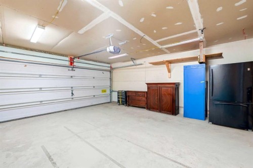 78 Cougar Plateau Way Sw, Calgary, AB - Indoor Photo Showing Garage
