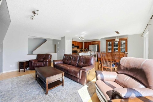 78 Cougar Plateau Way Sw, Calgary, AB - Indoor Photo Showing Living Room