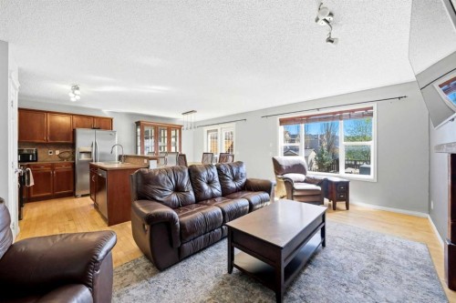 78 Cougar Plateau Way Sw, Calgary, AB - Indoor Photo Showing Living Room With Fireplace